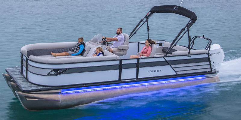 family with the crest patio boat cruising on the lake